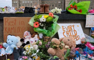 Memorial in tribute to 215 Indigenous children at the site of the former Kamloops residential school. meandering images/Shutterstock